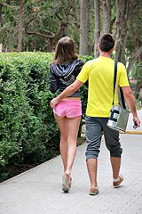 Pink shorts gal strolls in park